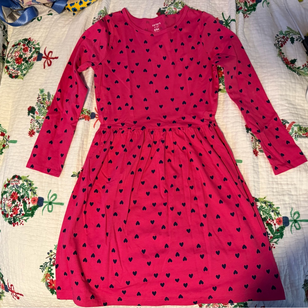 Great condition Carter’s dress. Pink & black hearted colored, size 8